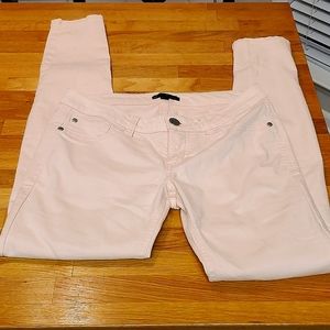 Pale pink skinny jeans